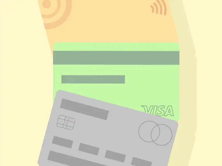 Payment cards fanned out on a pale surface